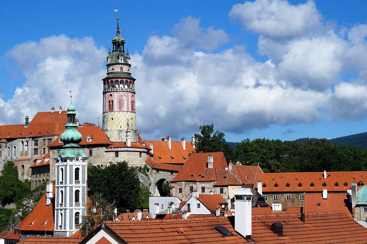 The Český Krumlov Castle tower above the town's red roofs.