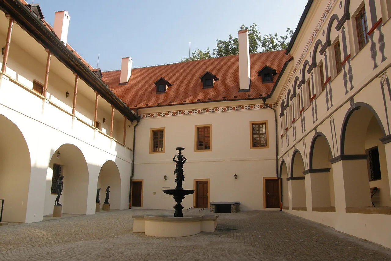 The arcaded courtyard of Blansko Chateau with its fountain.