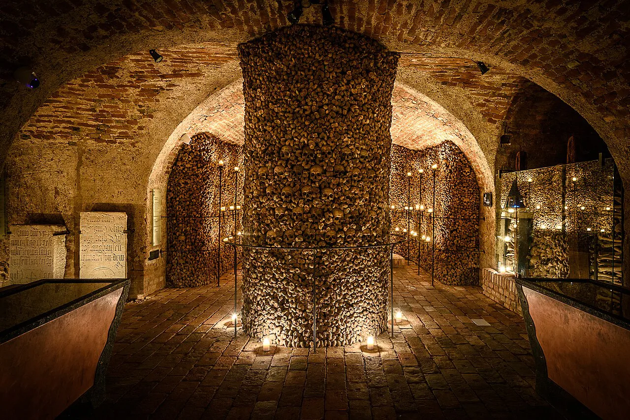 A pillar of stacked bones in the Brno Ossuary.