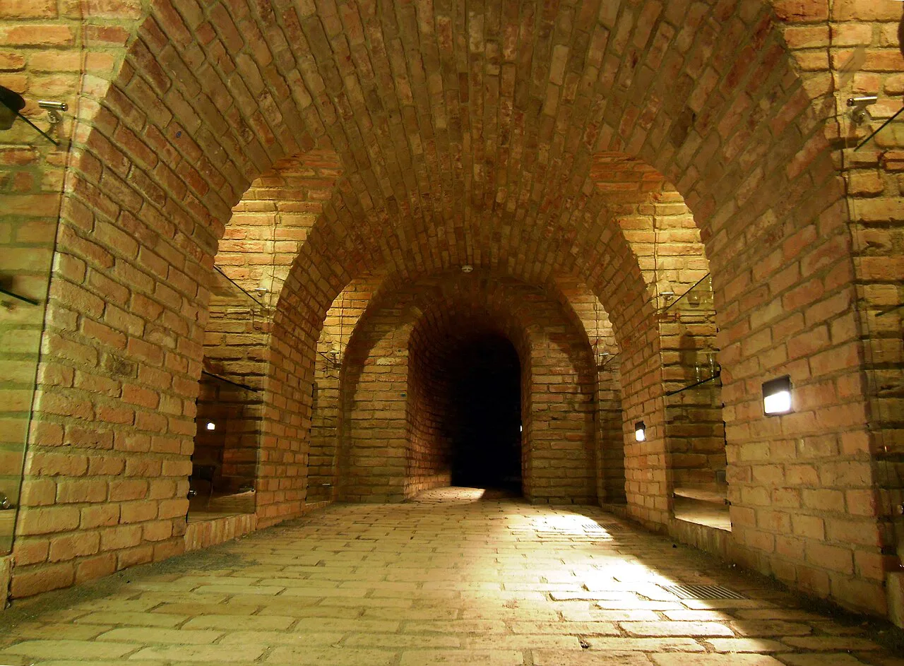 A brick-vaulted hall in the Brno Underground beneath the Cabbage Market.