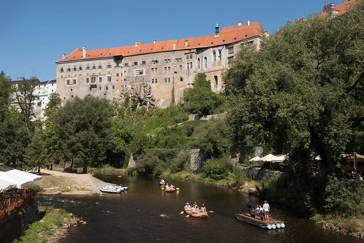 Český Krumlov Castle above the Vltava, with rafts on the river.