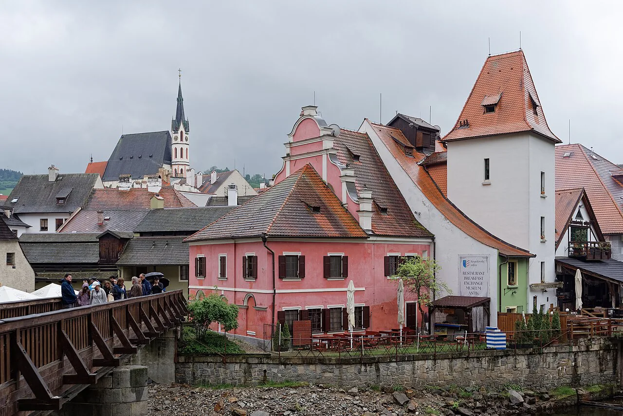 Český Krumlov's old town with the Church of St. Vitus and the Deer Footbridge over the Vltava.