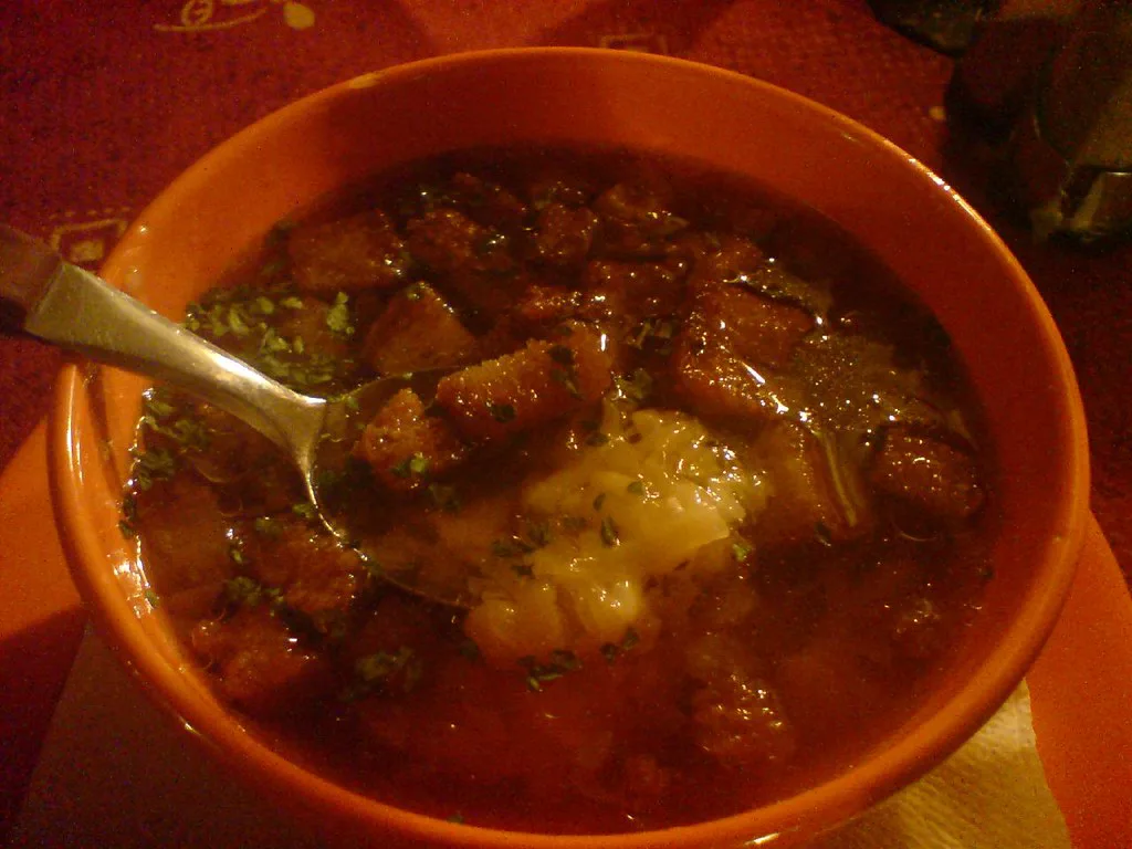 A bowl of česnečka, Czech garlic soup with croutons