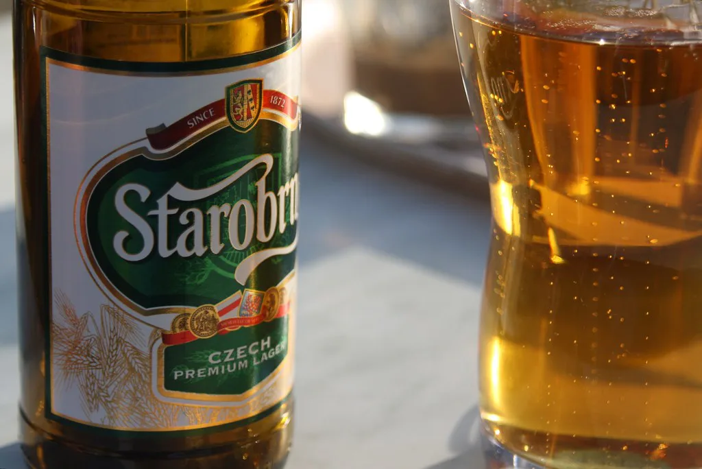 A bottle and glass of Starobrno lager.