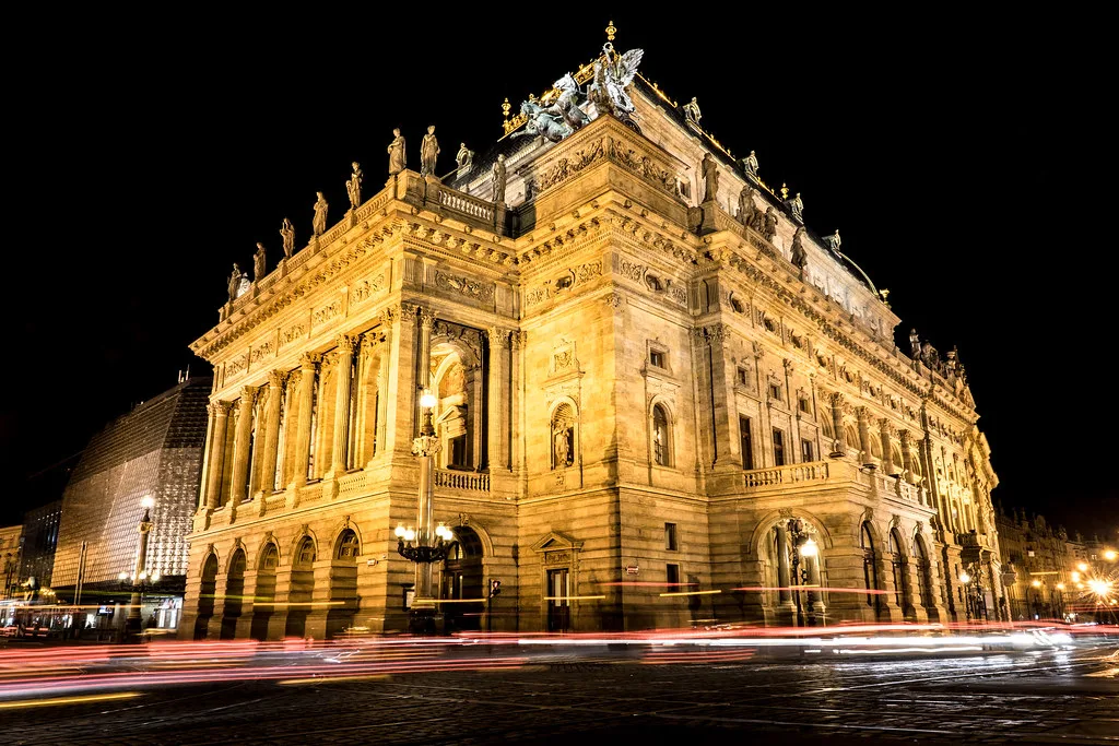 The National Theatre at the end of Národní Street in Prague, lit up at night