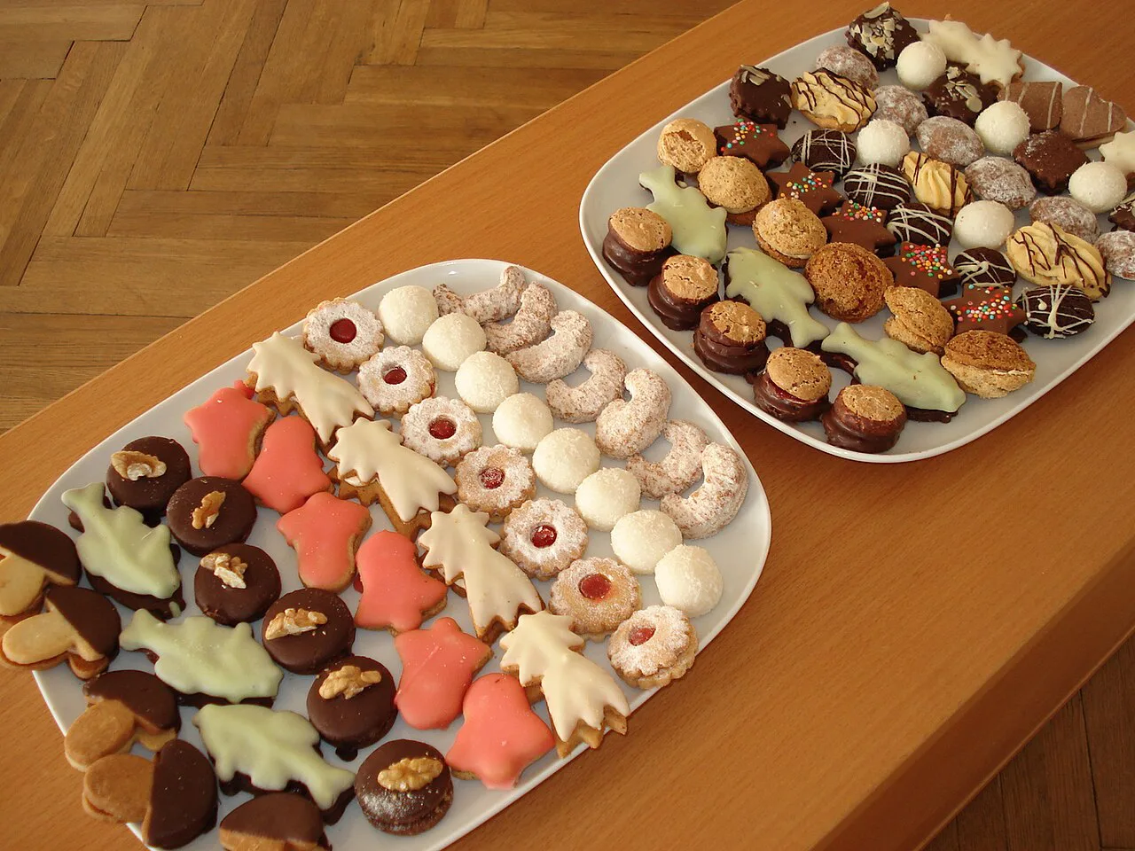 Plates of assorted Czech Christmas cookies (cukroví)