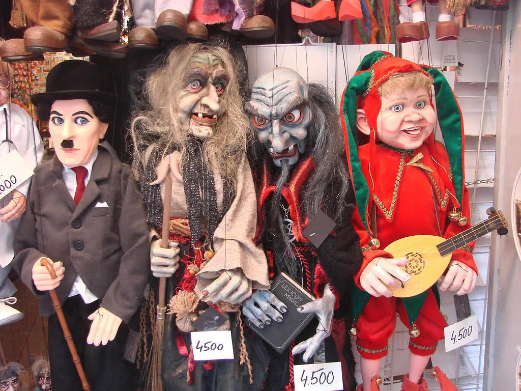 Marionettes of a witch, a devil and other characters for sale in a Prague souvenir shop