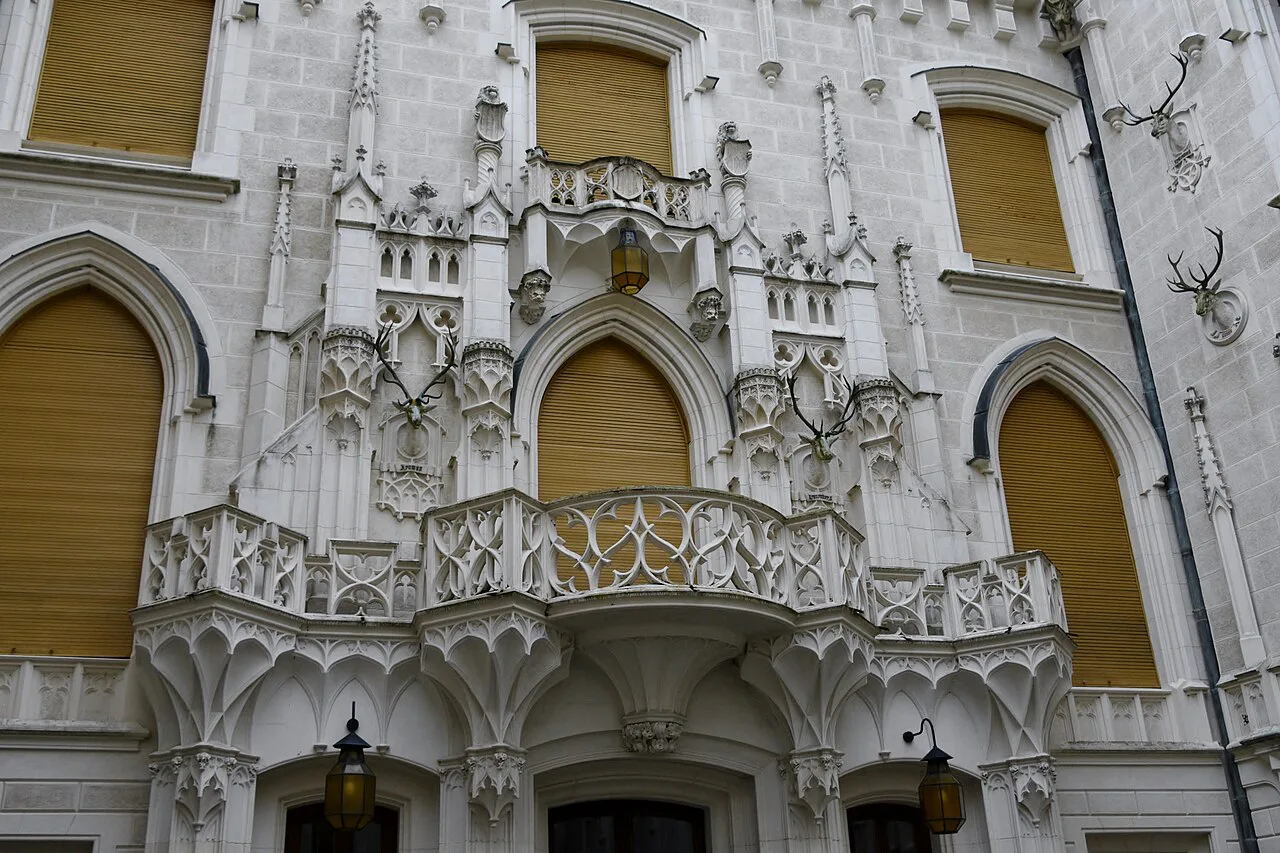 Ornate Gothic Revival façade details at Hluboká Castle.