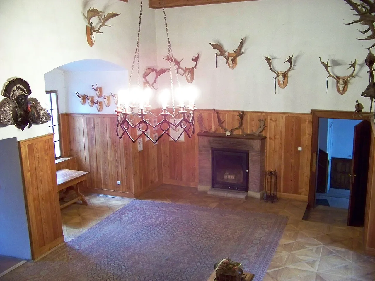 The hunting salon with antler trophies inside Houska Castle.