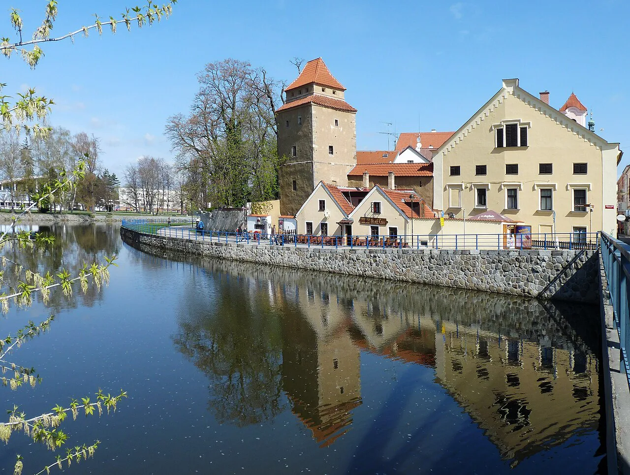 The Iron Maiden Tower reflected in the Malše river arm, České Budějovice.