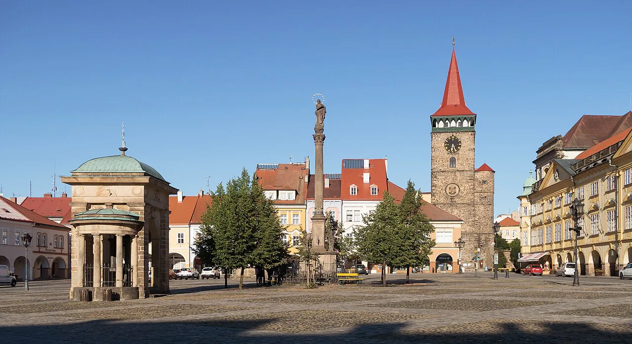 The old town square in Jičín with its Marian column and gate tower.