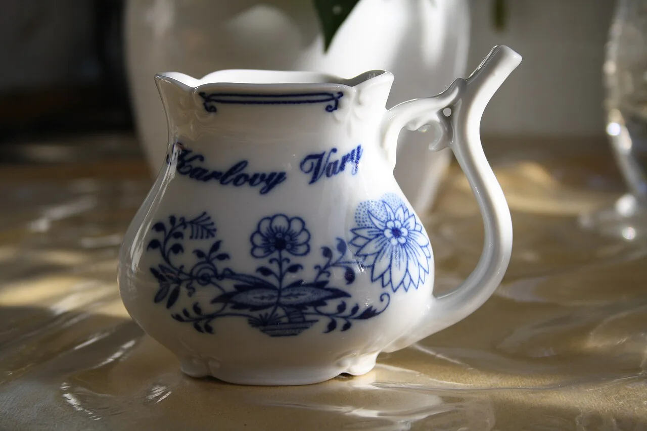 A porcelain Karlovy Vary spa cup with a spout for drinking spring water.