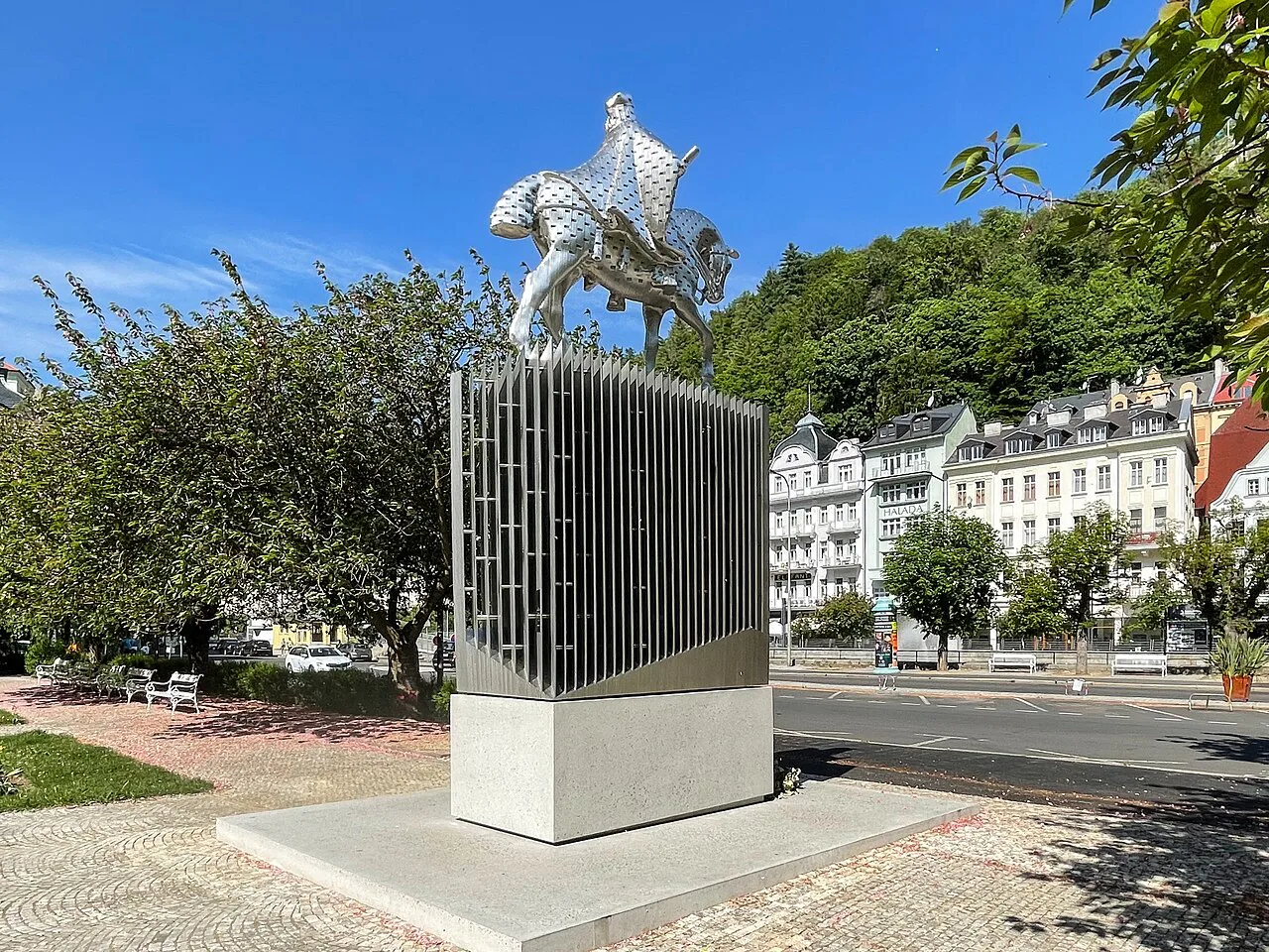 The Charles IV statue on Divadelní Square with houses on Stará louka, Karlovy Vary.