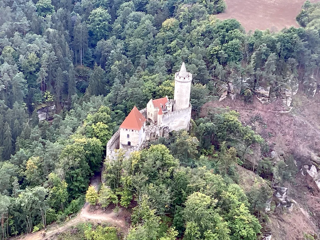 Kokořín Castle rising above the forested valley