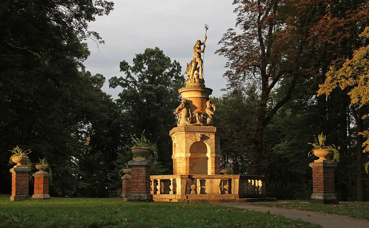 The gilded Poseidon Fountain in the park of Konopiště Castle.