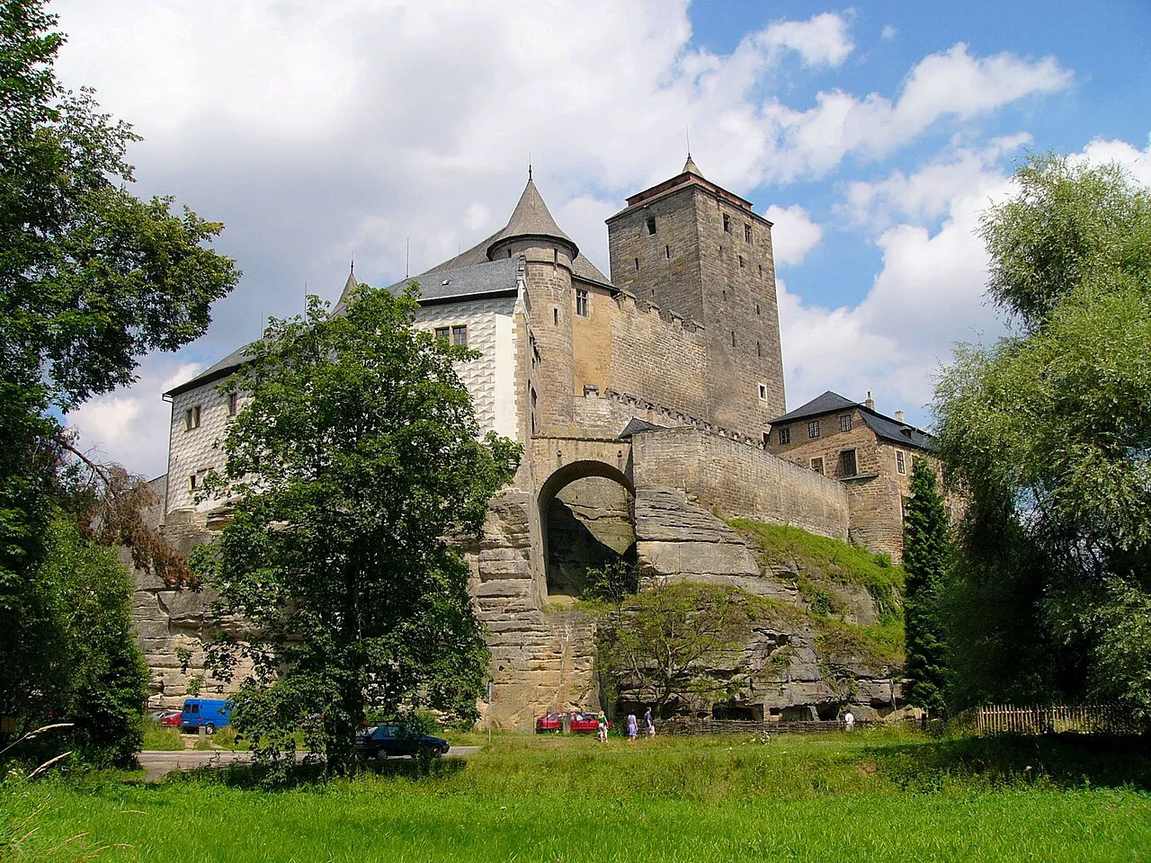Kost Castle seen through the trees on a sunny day.