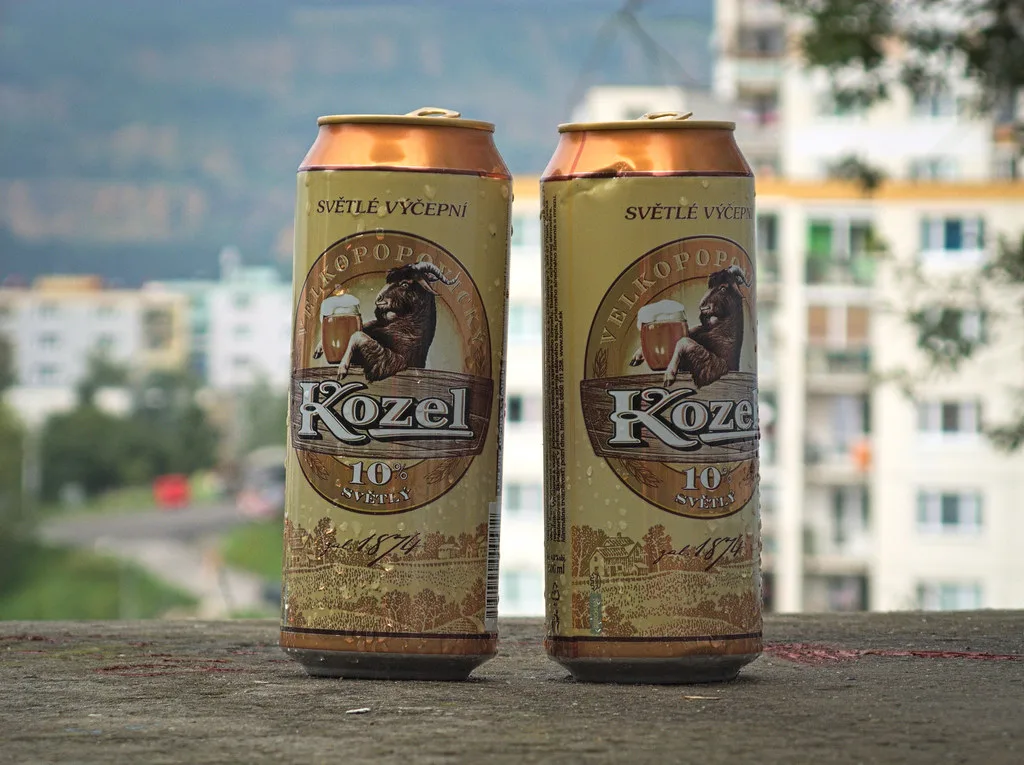 Two cans of Kozel Světlý pale lager