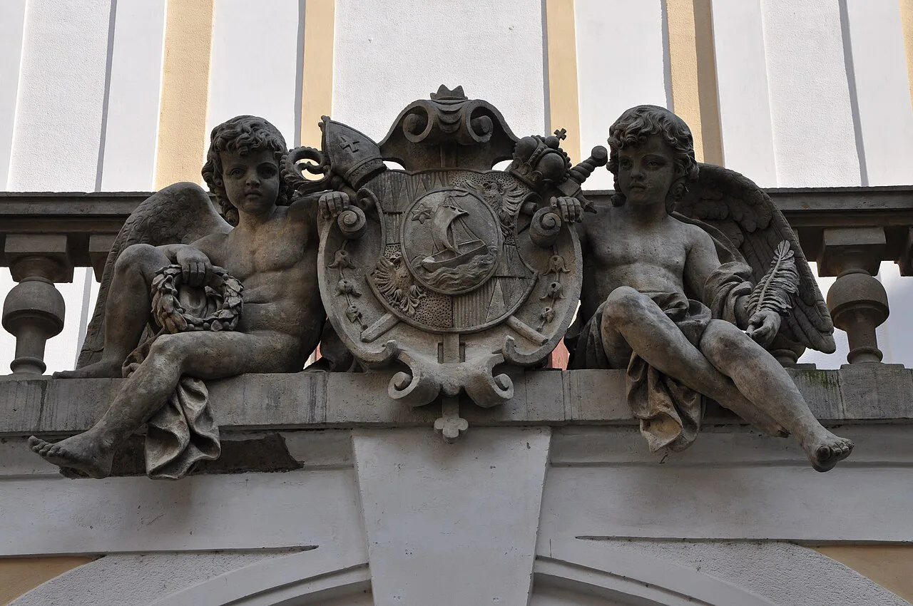 Coat of arms of Archbishop Theodor Kohn with angels on the Archbishop's Château in Kroměříž.