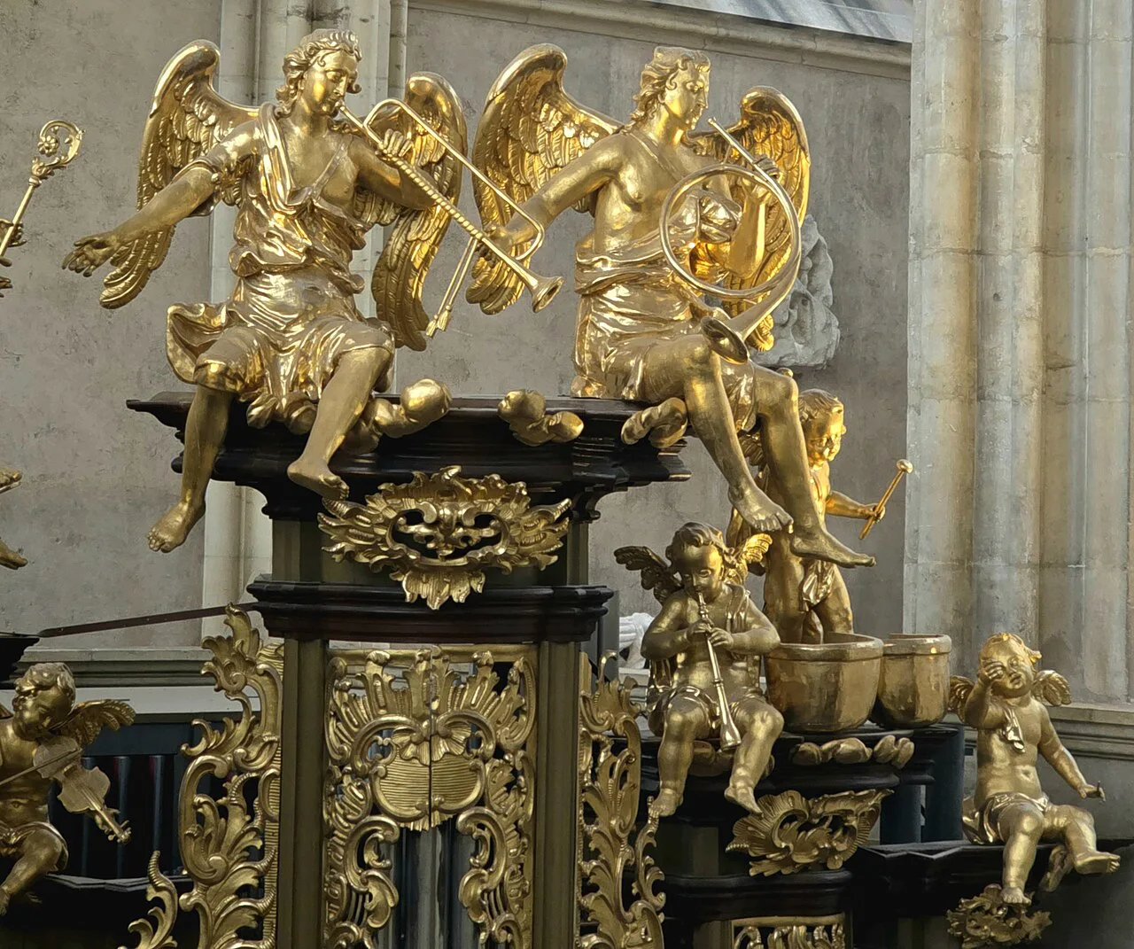 Gilded angel musicians on the organ case in St. Barbara's Church, Kutná Hora.