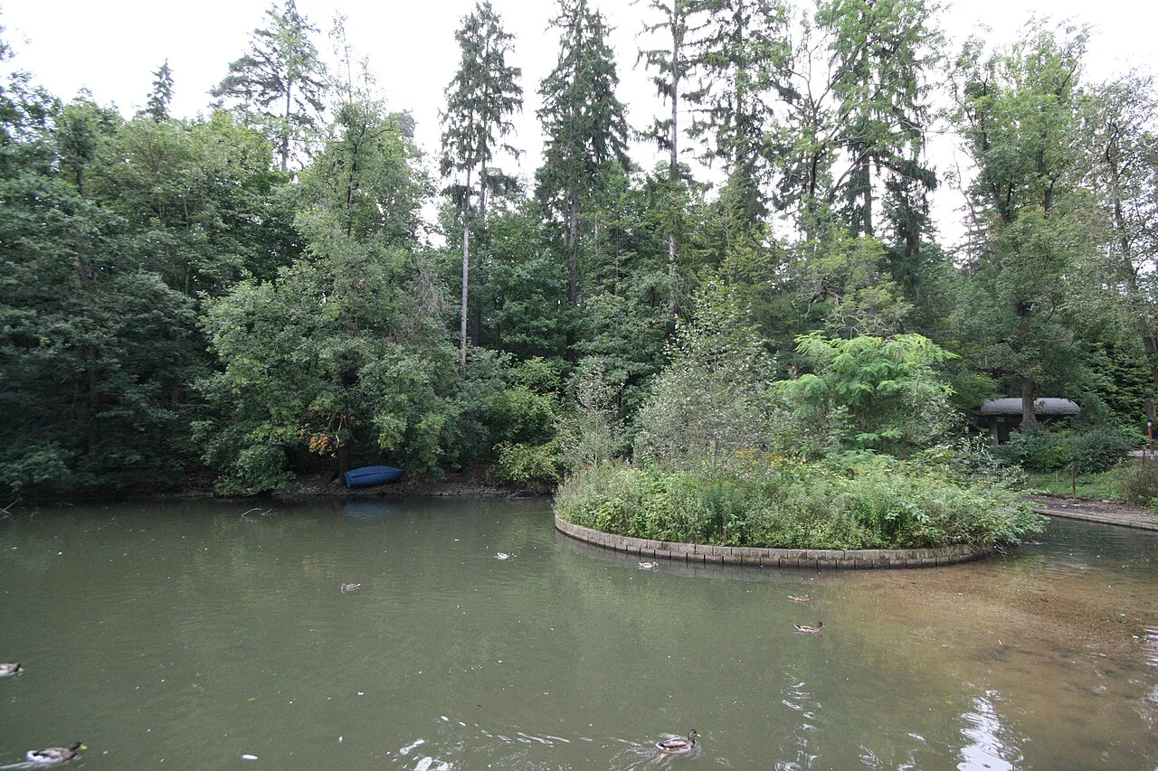 A pond with a planted island at Liberec Zoo.