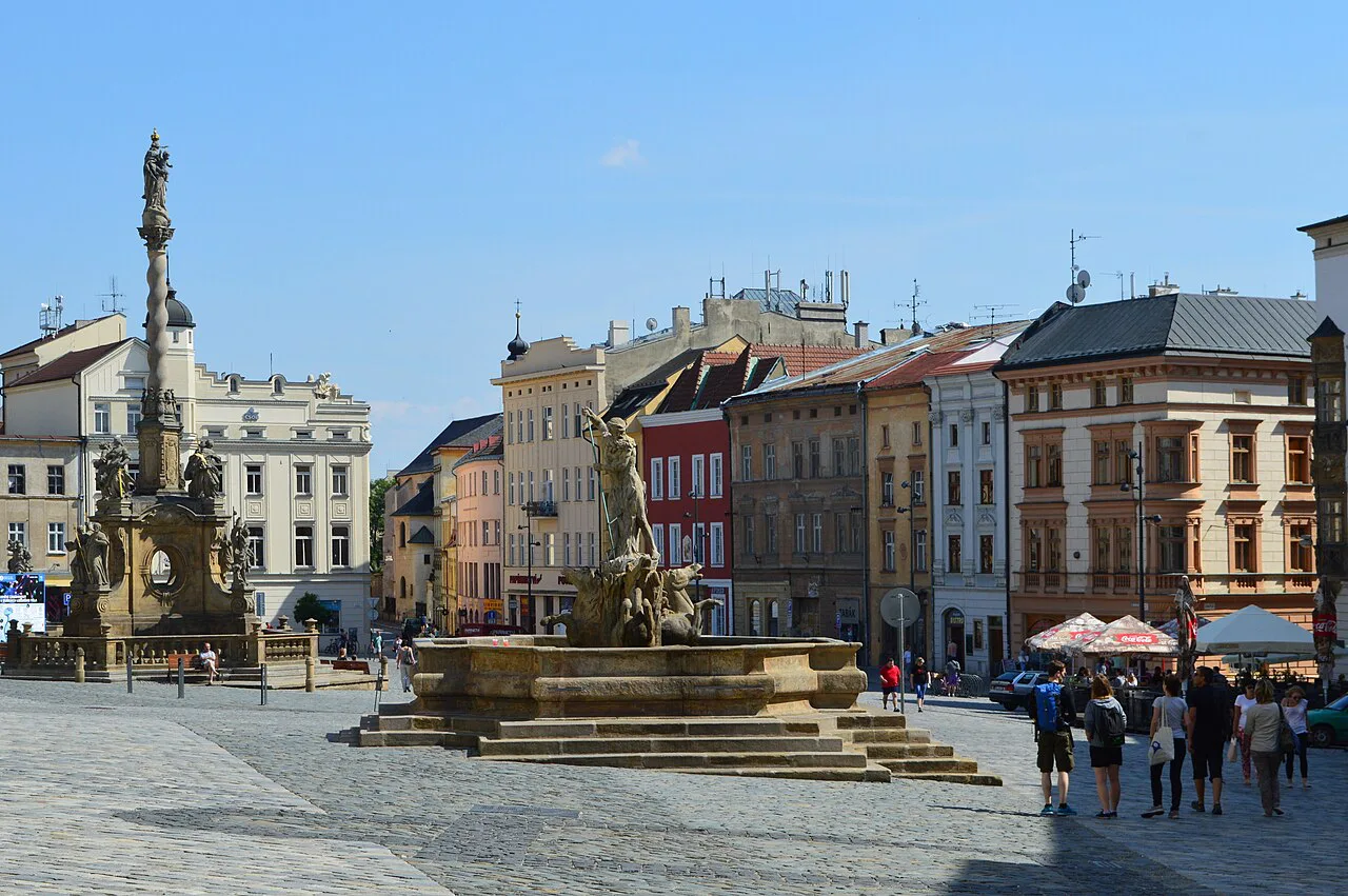 Dolní náměstí in Olomouc, with the Marian Plague Column and a Baroque fountain.