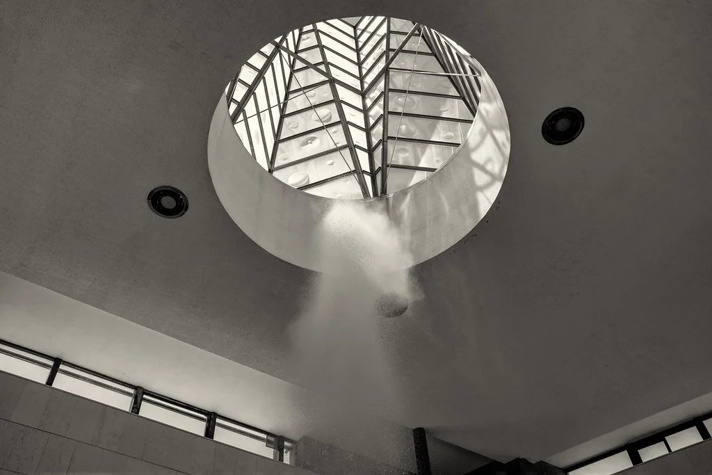 The Vřídlo geyser rising toward the skylight inside the Hot Spring Colonnade in Karlovy Vary