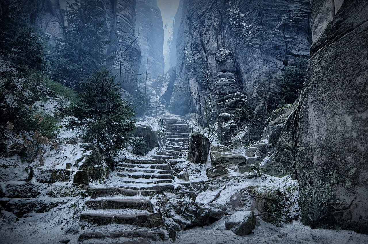 Snow-covered steps through the Emperor's Passage at Prachov Rocks.