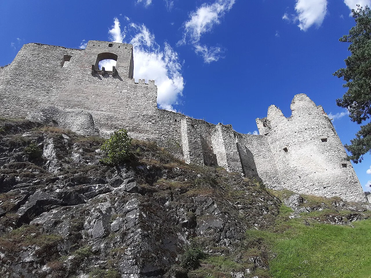 Ruined walls of Rabí Castle on their rocky outcrop.