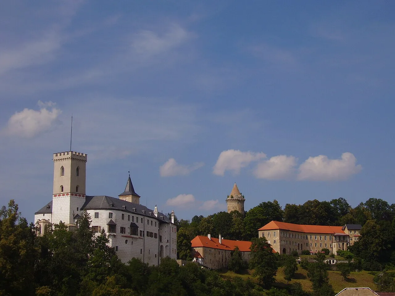 Rožmberk Castle and its tower above the trees.
