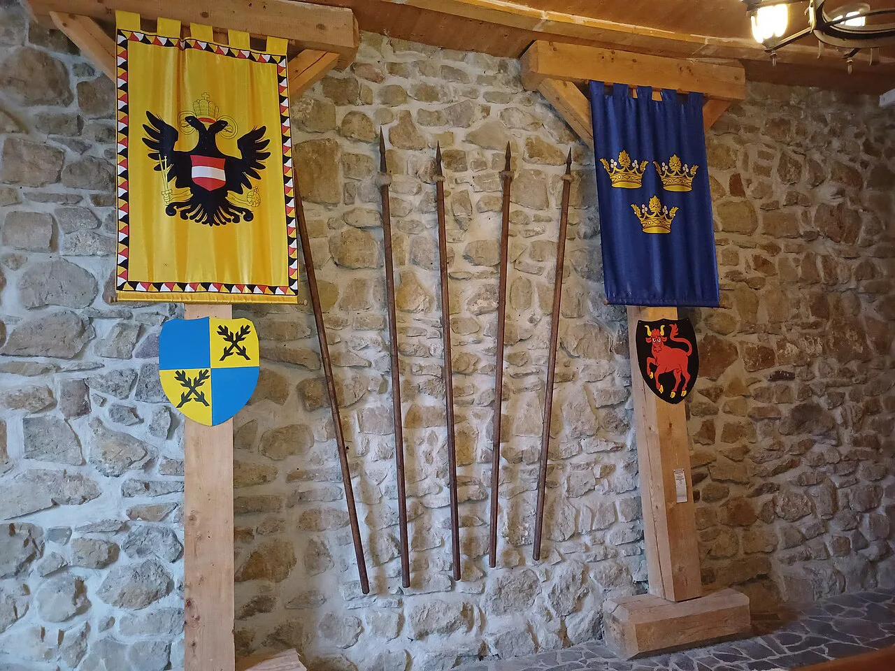 Heraldic banners and weapons inside Silesian Ostrava Castle.