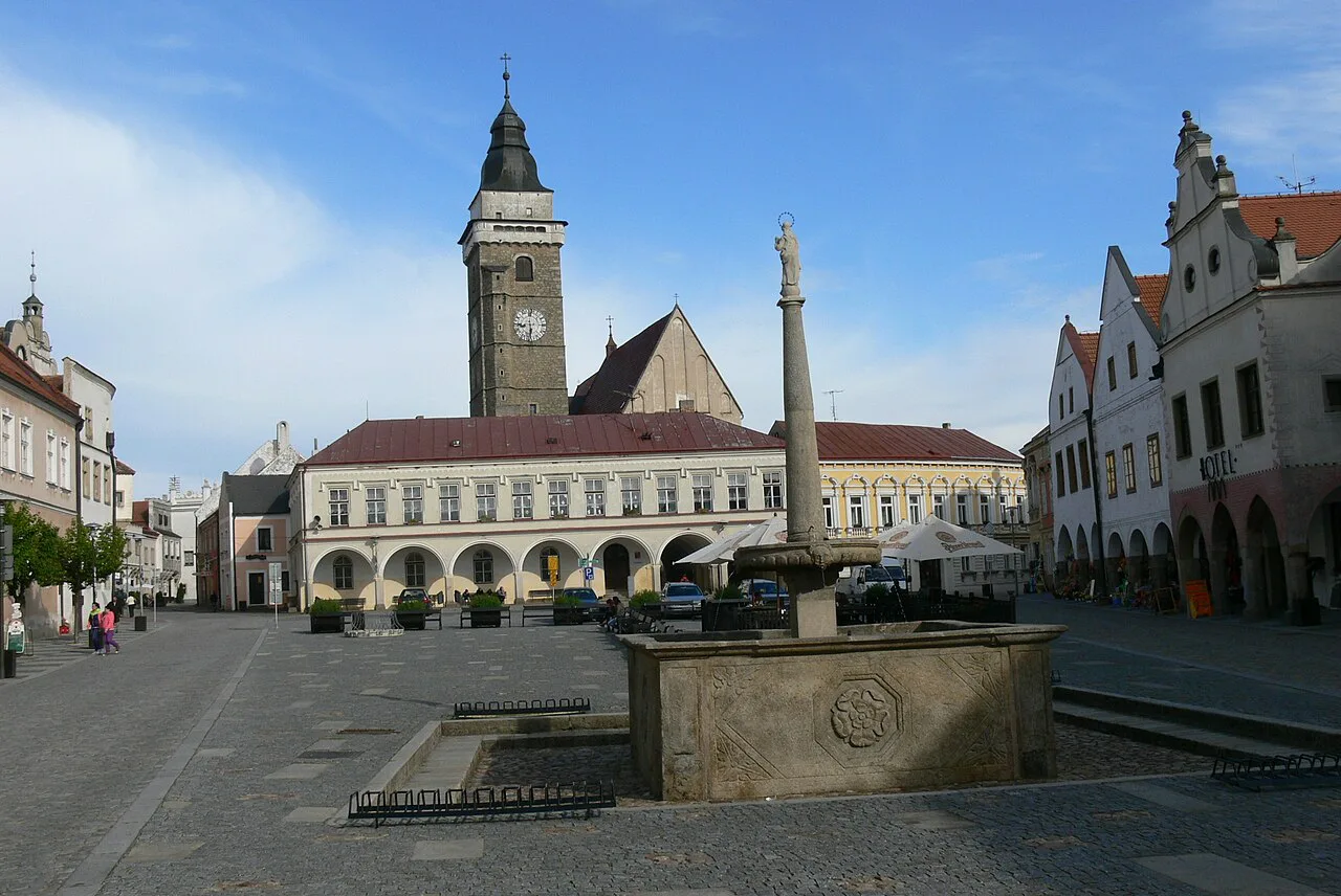 Main square in Slavonice with a fountain, town hall and church
