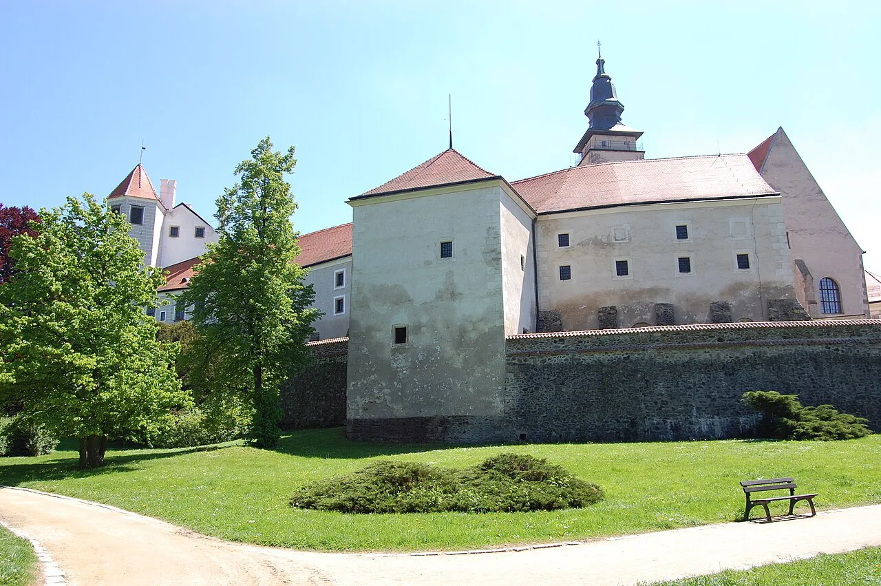 Historic buildings above a park in Telč.