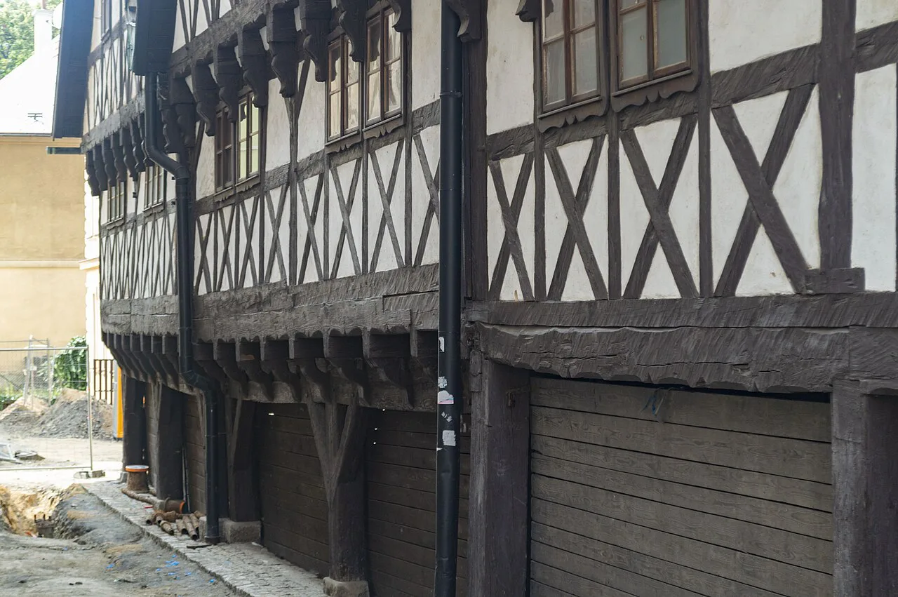 The timber-framed lower storey of the Valdštejnské domky on a Liberec street.