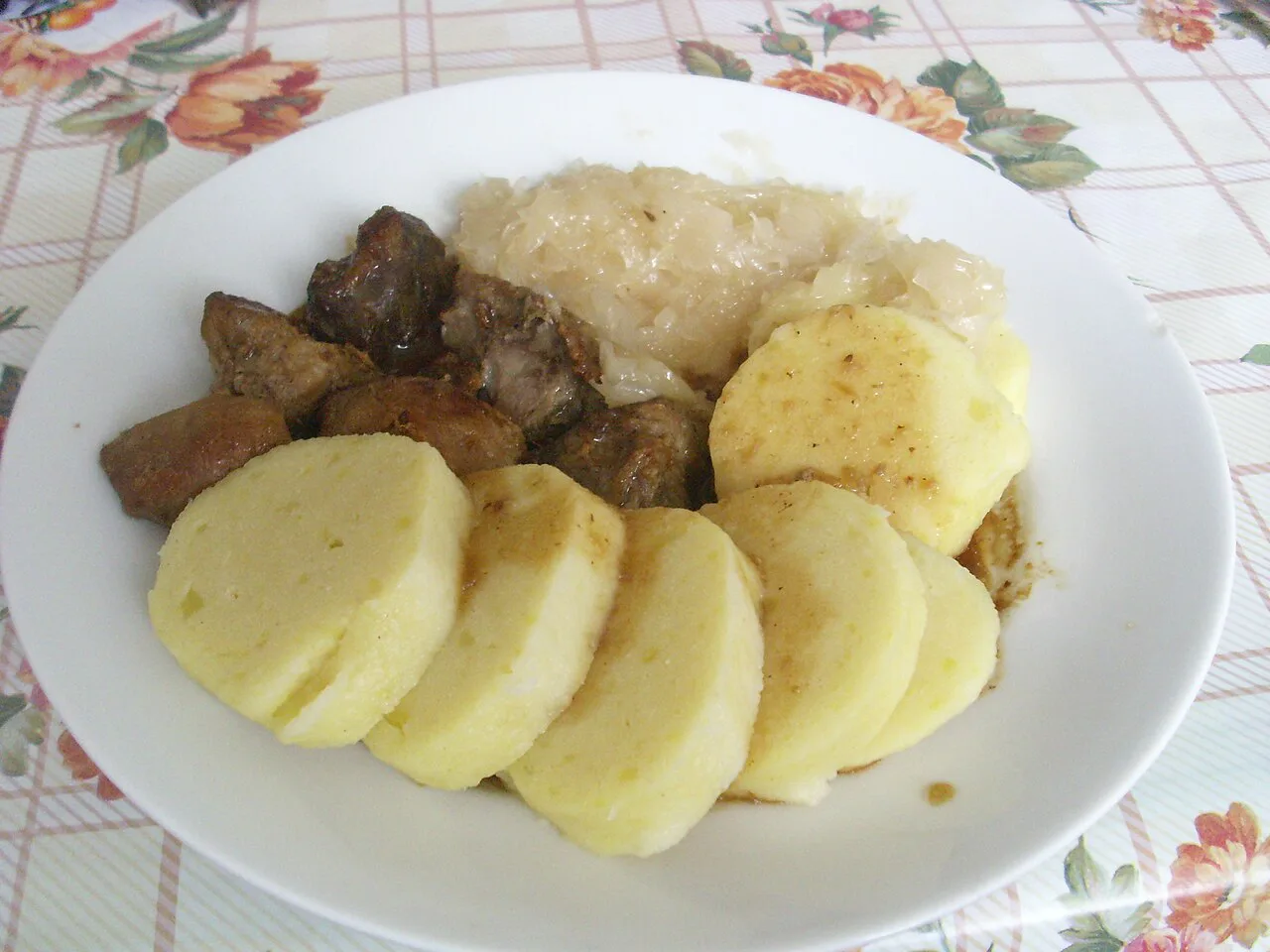 Vepřo knedlo zelo: roast pork with bread dumplings and sauerkraut.