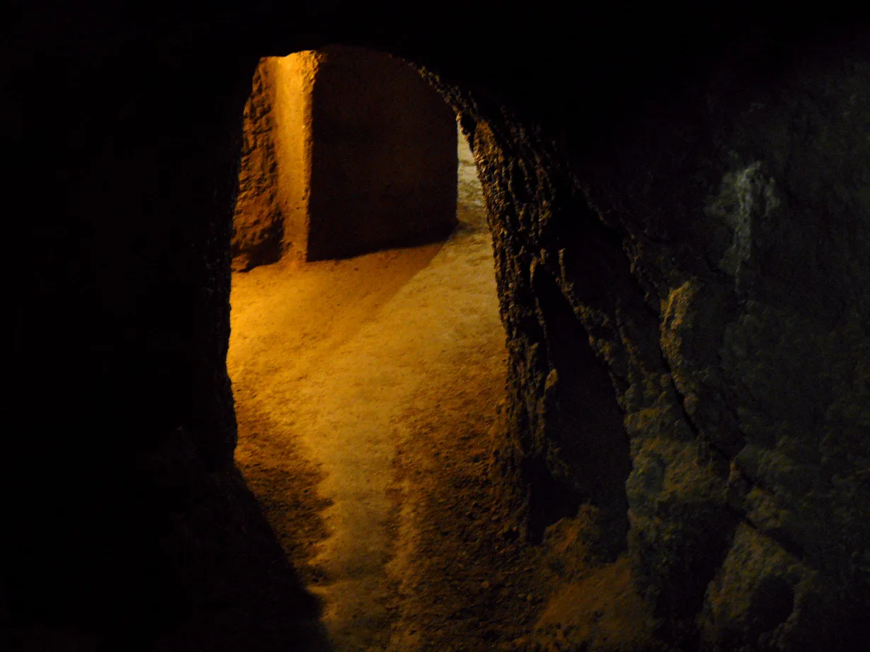 A lamp-lit corridor in the Znojmo Underground.